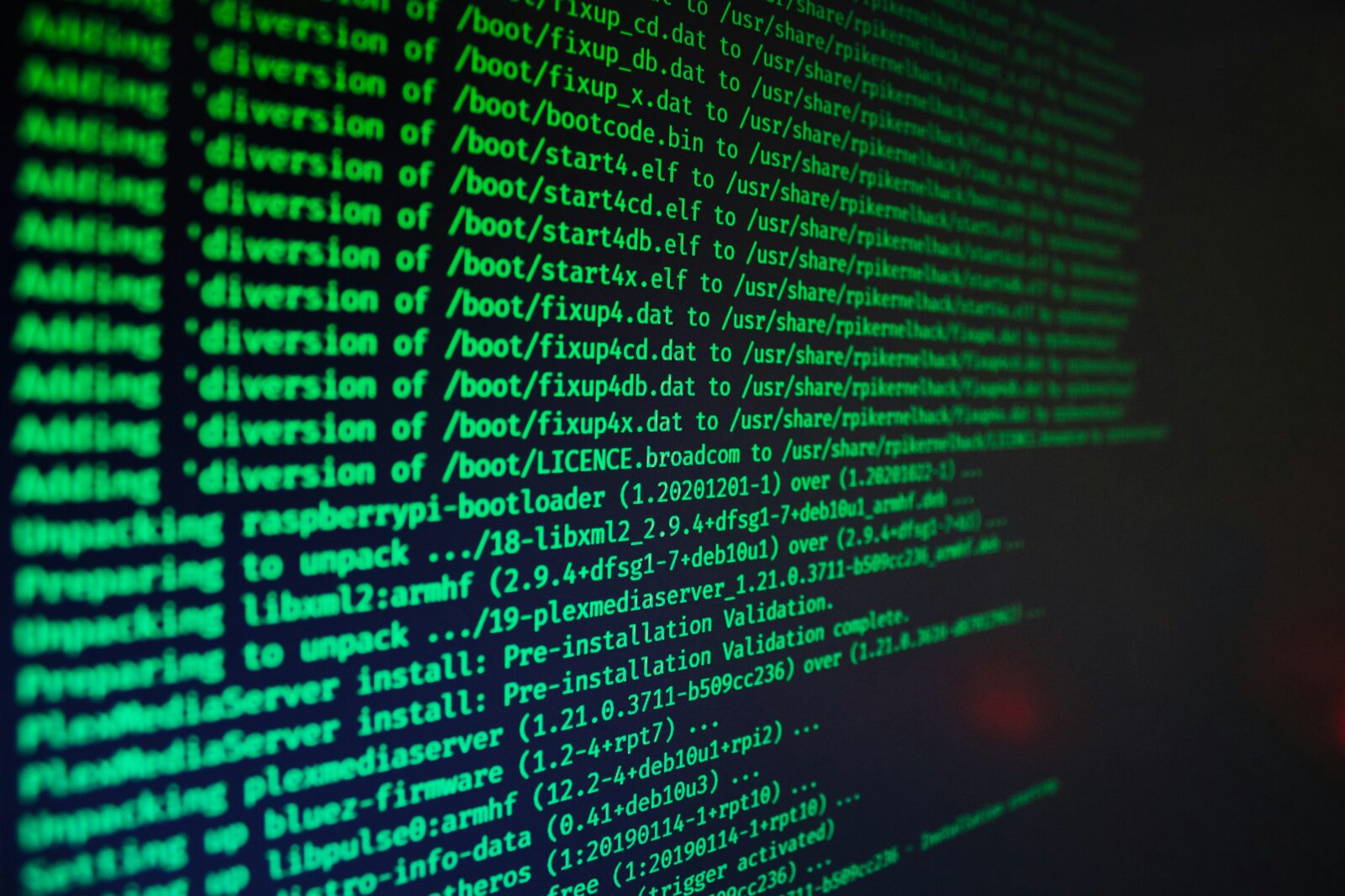 Computer terminal filled with green text. Photo by Jake Walker on Unsplash.